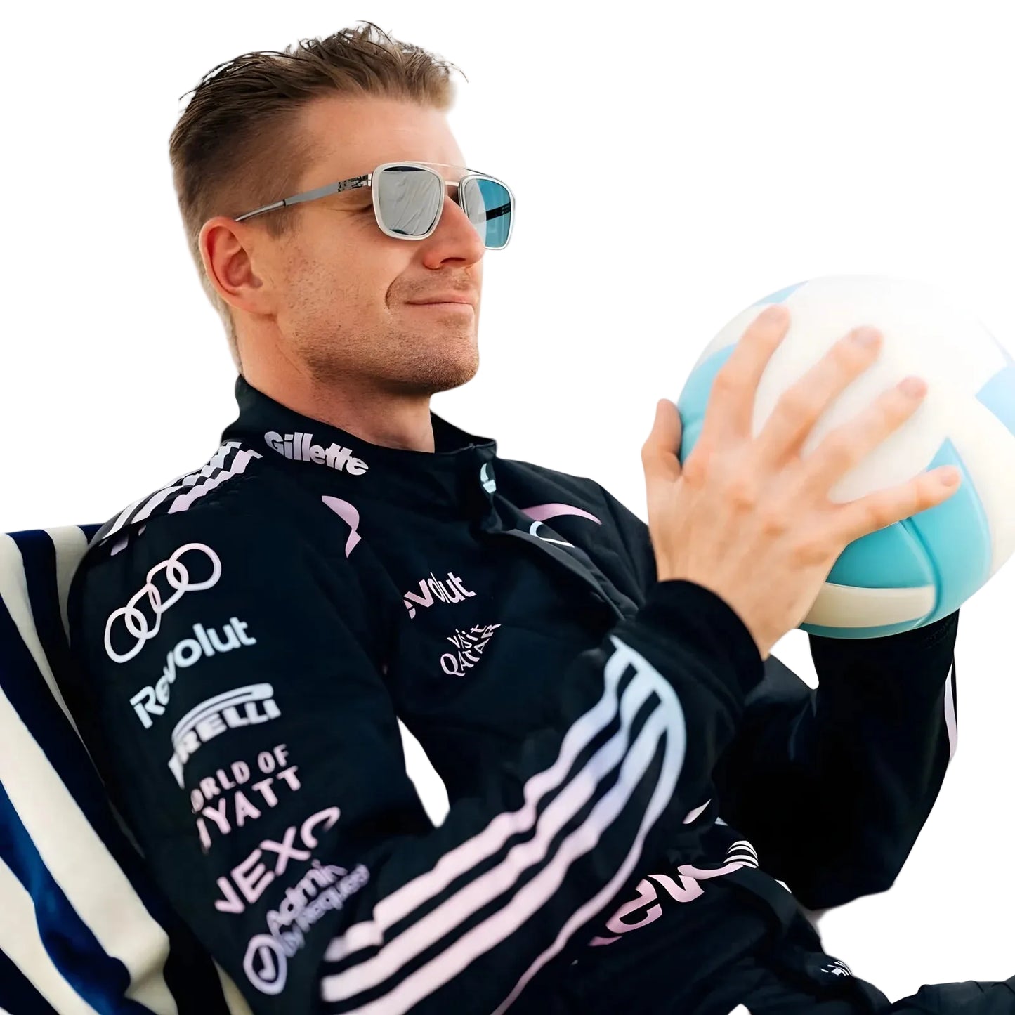 Person wearing a black jacket with sponsor logos, holding a sports ball. Ex Race Gear
